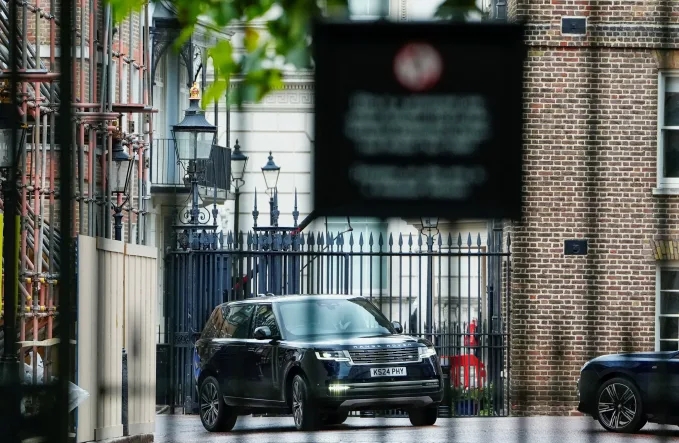 Prince Harry arriving in a black SUV