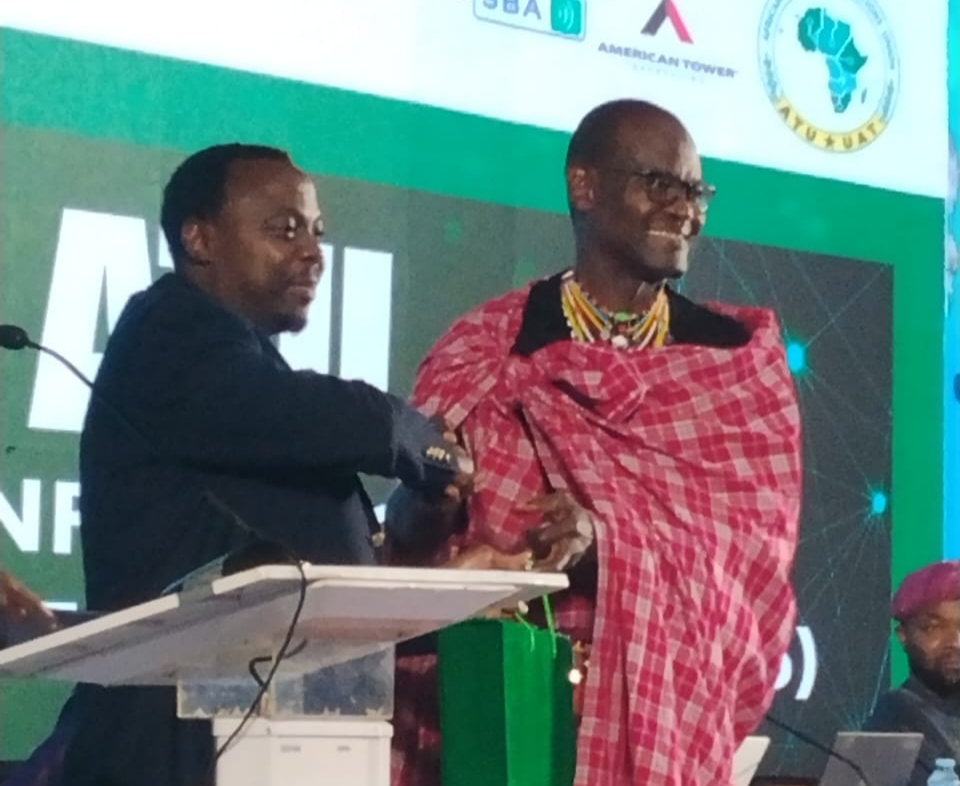 From R-L The Outgoing Secretary General Africa Telecommunication Union Johh Omo, handing over to the Sec Gen Elect Kesias Mwale at the ATU 7th 